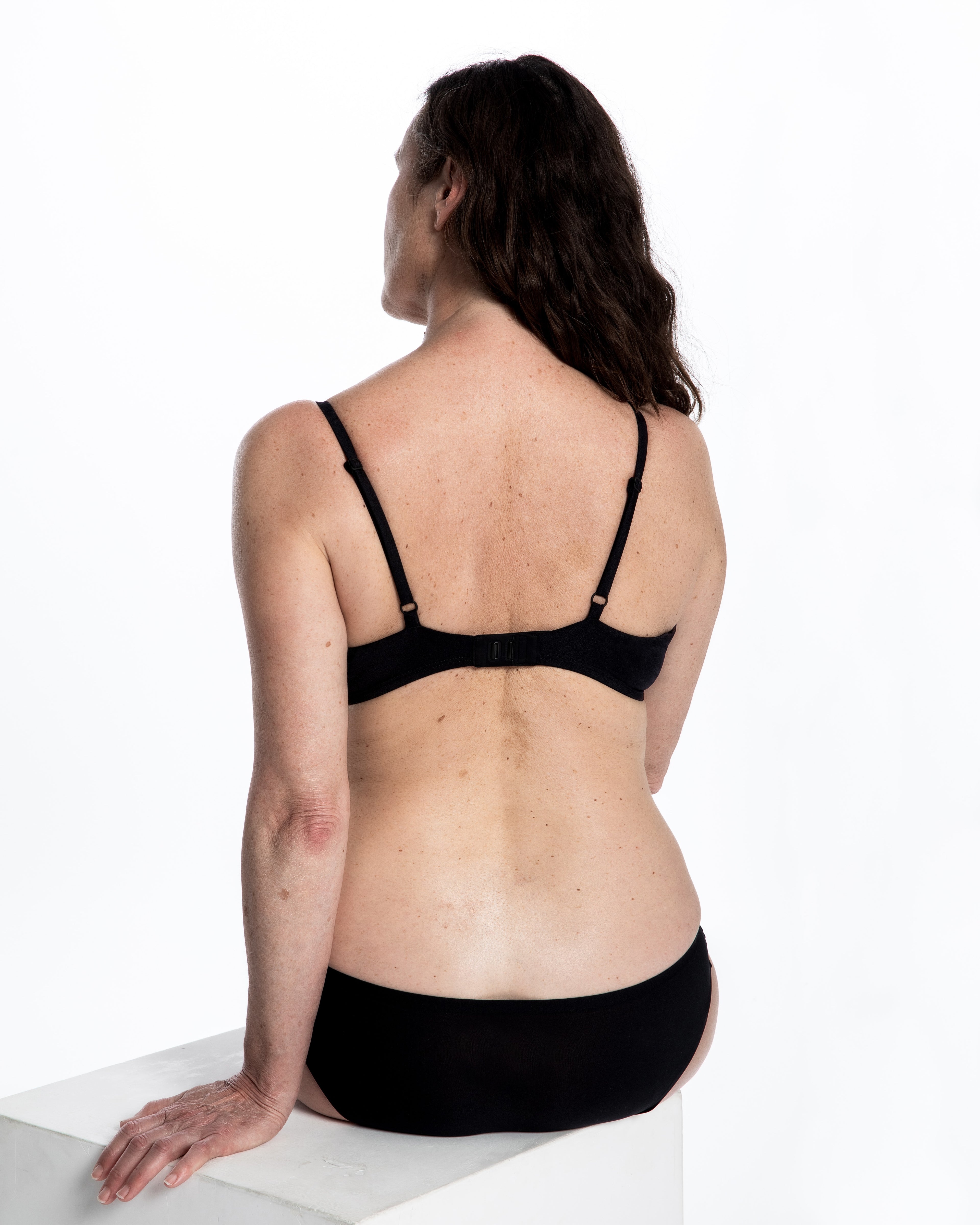 Wireless one-cup mastectomy bra in soft silky black fabric, post-surgery lingerie by ENO
